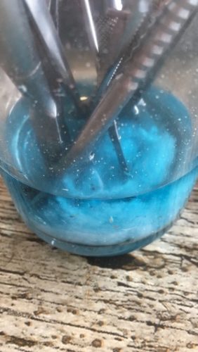 Started to evaporate & congeal. Is contaminated with hairs & more.