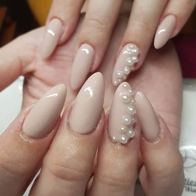 Chantelle Crerand uses pearls to frame this elegant almond nail 
