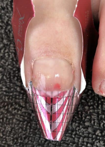 Step 5: Apply a small bead at the cuticle, making sure the application is flush, so it will not lift.