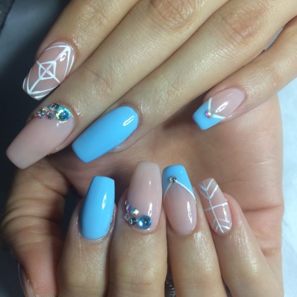 Carrie-Leigh Allen showcases freehand geometric nail art in this design featuring nude and sky blue hues, finished with a sprinkling of crystals.