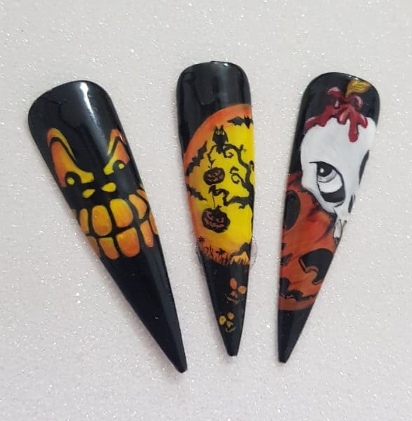 Louella Belle educator, Carrie-Leigh Allen, uses acrylic paint to create spooky designs