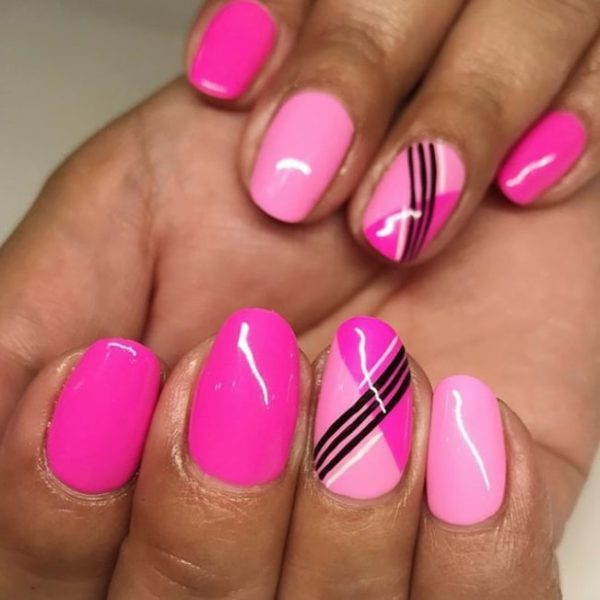 The team at Notorious Nails created this zingy pink look