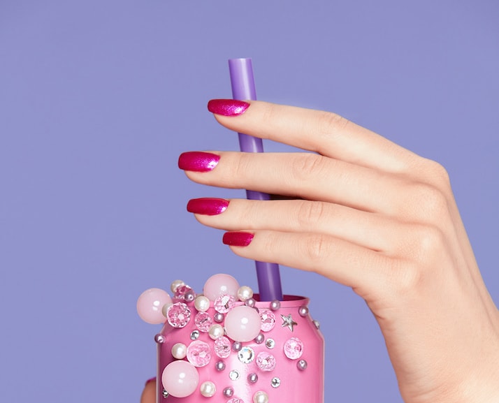Pink Nails. Woman With Soda Can In Hands On Purple Violet Background. Close Up Of Female Hands WIth Bright Manicure Holding Pink Soda Can With Beads. Nails Design. High Quality Image.