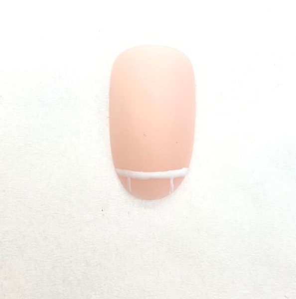 3. Paint two vertical lines from the previous line approximately a quarter of the way across the width of the nail from both outside edges.