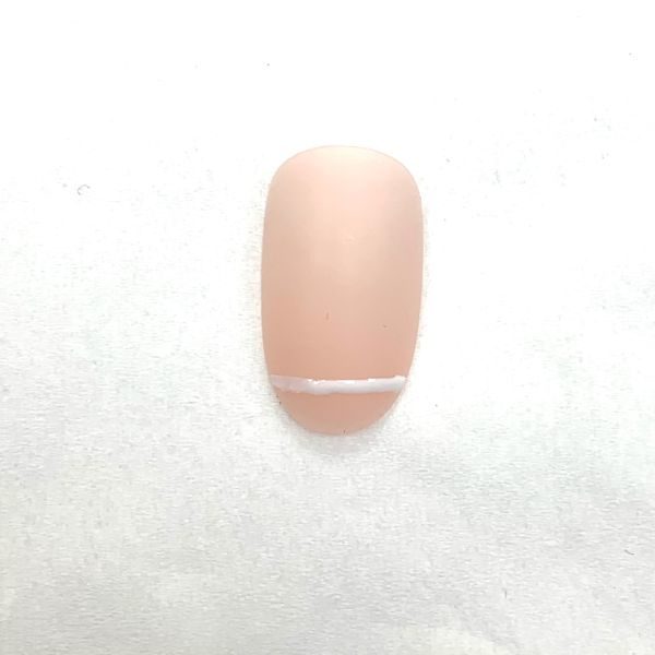 2. Use a fine brush or dotting tool to paint a straight line across the free edge. Do not cure.