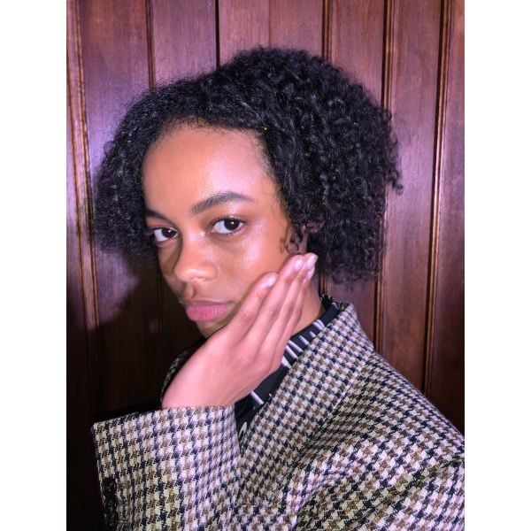 This model shows off shiny nude nails