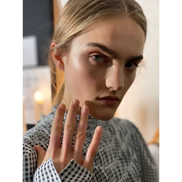 One of the models displays her nude and natural nails