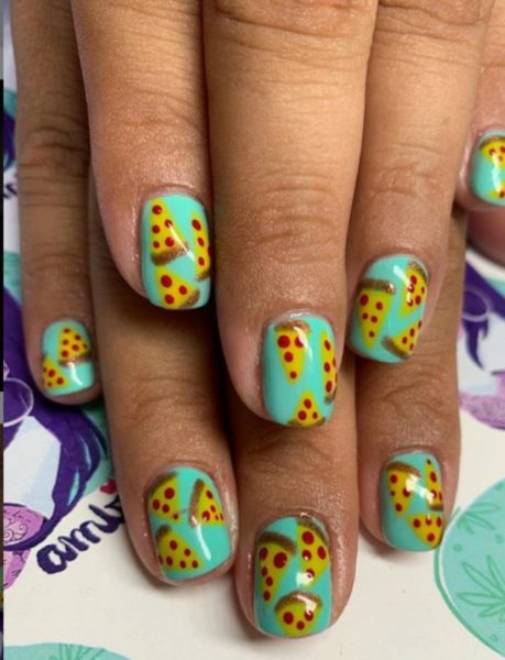 Get a slice of the action with this nail art on a bold turquoise base, by Ambie at @ambies_nails_n_nugs