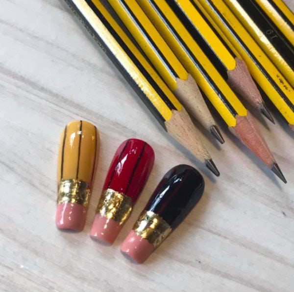 This pencil and eraser design was created by Beloved Nails Lytham