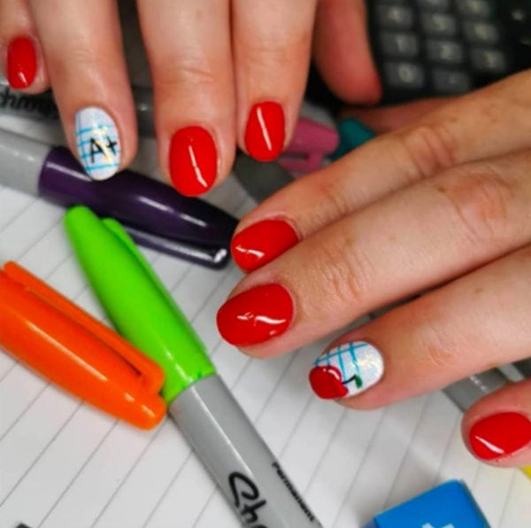 This red set has notebook feature nails, designed by Danielle Page