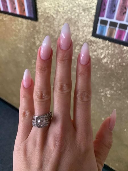 Sarah Shakespeare, owner of Magpie Beauty, wears Full On Tips in the Almond shape