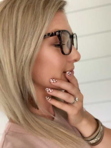 Alyssa Fronce
"My entry represents me because as a nail tech I enjoy a clean simple look, which I tried to portray in this picture. Between the white shiplap background, the simple floral nail art and the clean cuticles. What you see is my style and persona played out perfectly!"