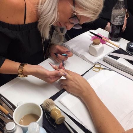 Nail tech, Katie Barnes, at work