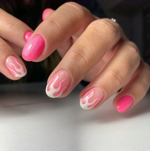 Nichole Baker of @topcoat_tonic outlines white shimmery flames on tips with a punchy pink shade.