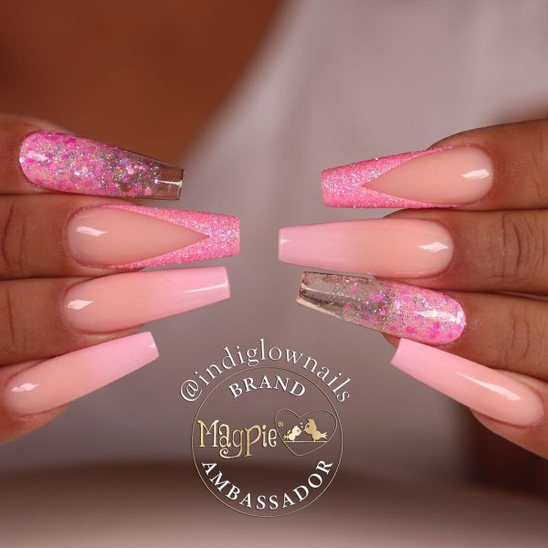 Magpie Beauty ambassador, @indiglownails, mixes and matches pretty pink design elements, including ombrés and V-shaped glitter French tips.