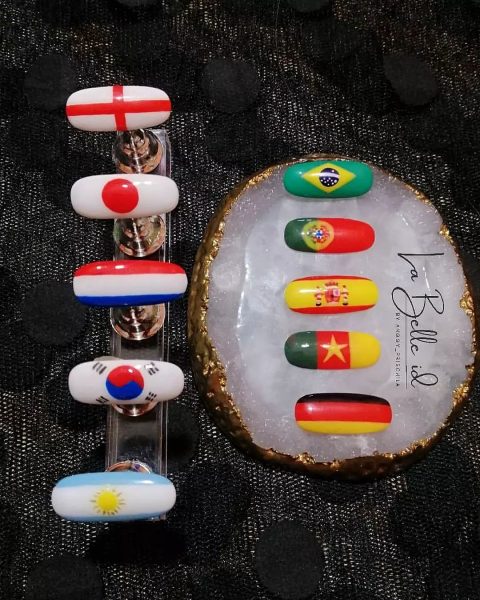 @labelleid_byanggie paints flags of countries involved in the Cup