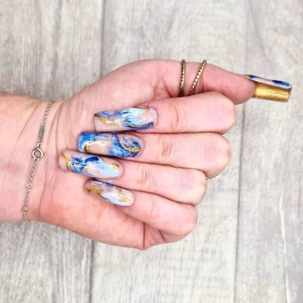 @adorn.nailsbyamymay - "Double sided nails is this year's hot new trend, along with extreme marbling"