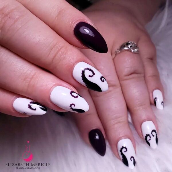 @mericlenails creates a nail look perfect for Ursula fans. 