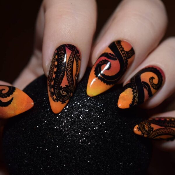 @polishedbyydot captures the spooky essence of the sea witch, Ursula, with their intricate tentacle nail style.