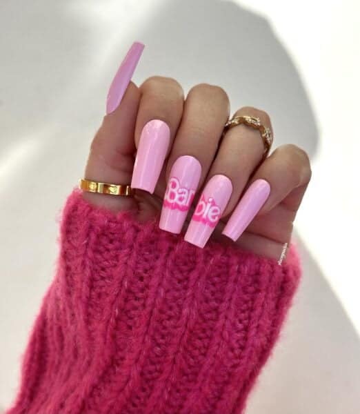 Glitterbels ambassador, @staceymachin, paints the Barbie logo across two feature nails.