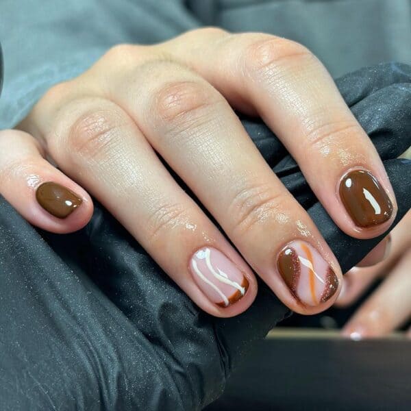 Canadian tech, @_nailsbyalex, adds a touch of caramel colour to this latte look.