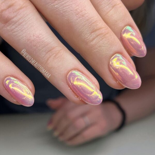 These pearly pink oval nails come courtesy of @beholdbeautyomaha.