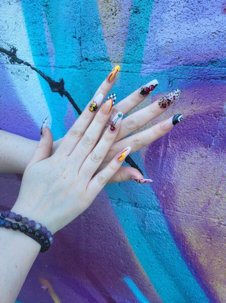 Emma Lee - "Square, long, bold, pick 'n' mix designs, with colour and style cohesive but all individual."