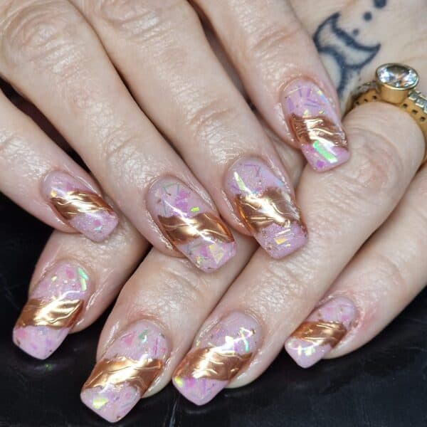 Nicci Coleman - "Chrome and iridescent nails for 2024."