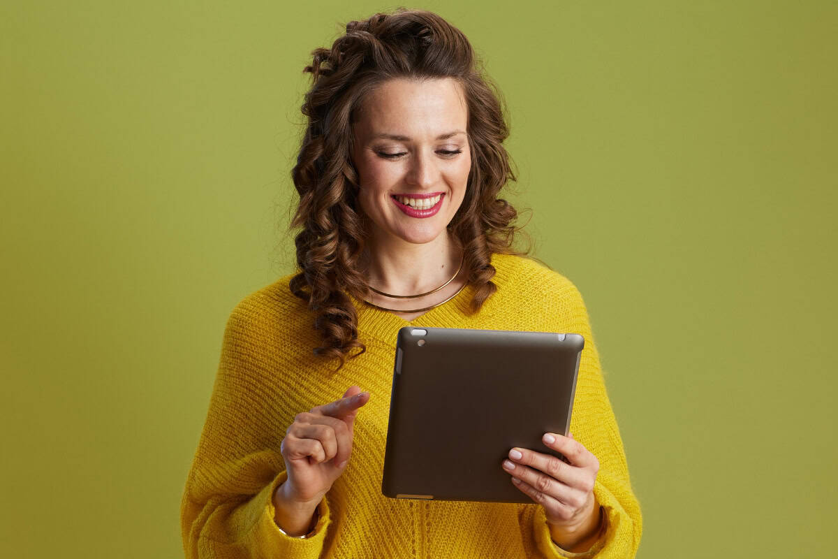 Woman on tablet happy