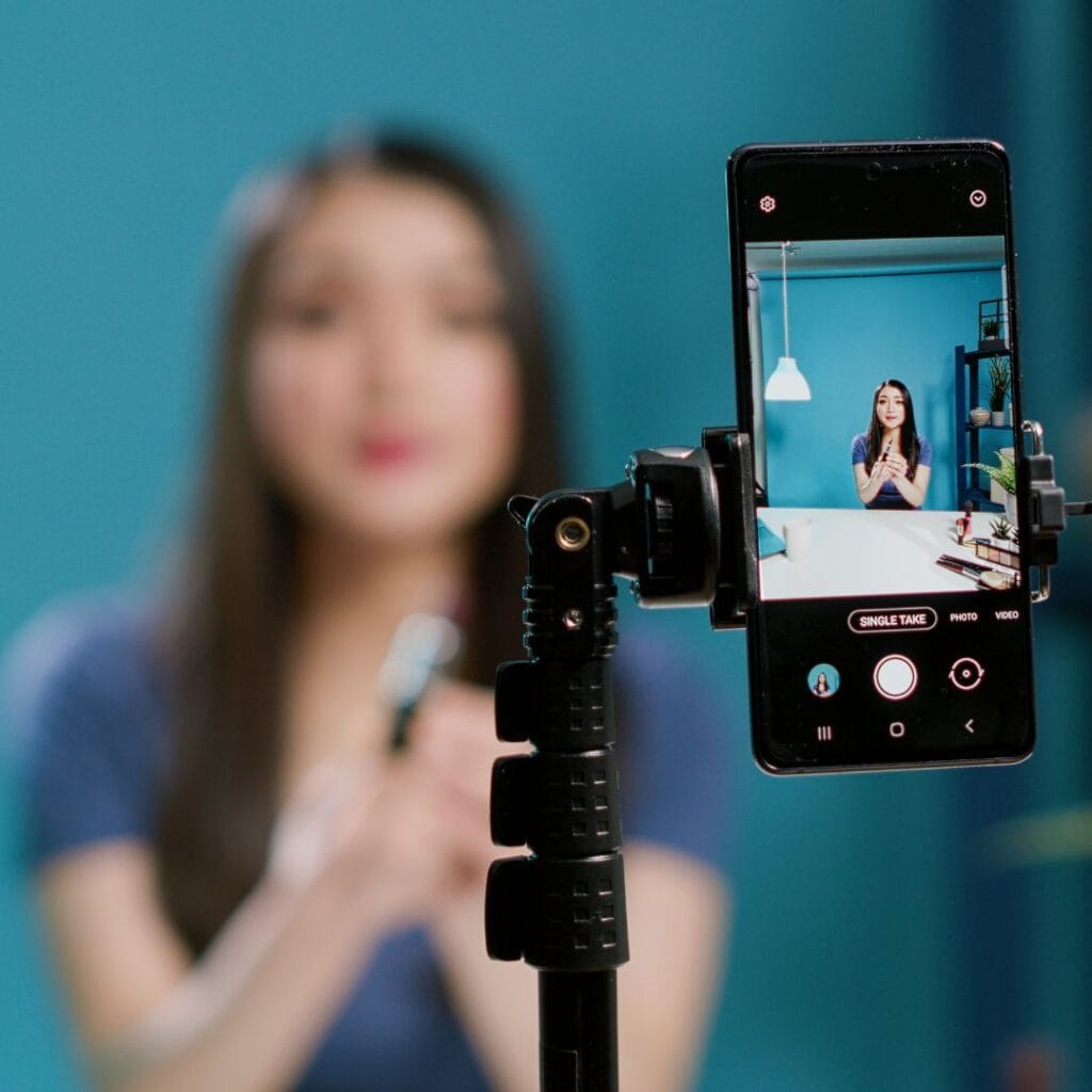 Content creator using tripod